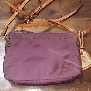 Dooney & Bourke Women's Purple Crossbody Bag With Adjustable Leather Strap.